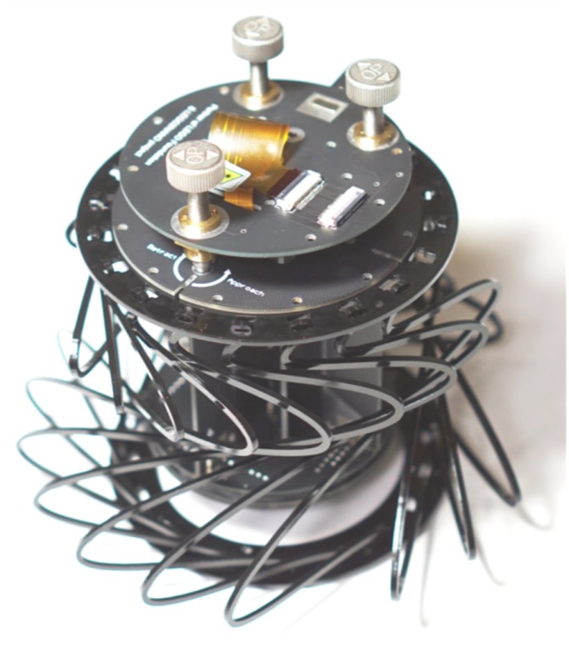 The Strømlingo scanner head, a stack of black circular decks held apart by curved struts.